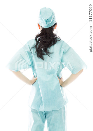 Rear view of an Asian female surgeon standing with hands on hip Rear view of an Asian female surgeon standing with hands on hip 11177069