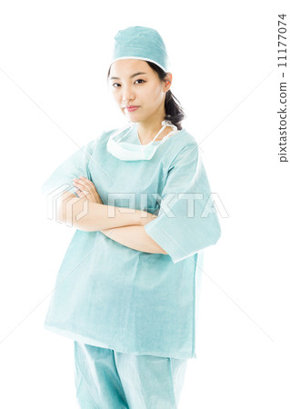 Confident Asian female surgeon standing with arms crossed Confident Asian female surgeon standing with arms crossed 11177074