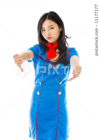 Unhappy Asian air stewardess giving thumbs down gesture Unhappy Asian air stewardess giving thumbs down gesture 11177177