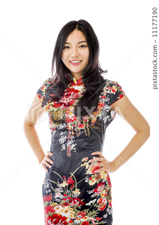 Confident Asian young woman standing with arms akimbo 11177190