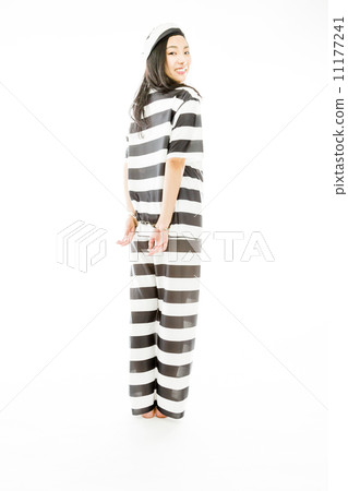 Handcuffed Asian young woman in prisoners uniform 11177241