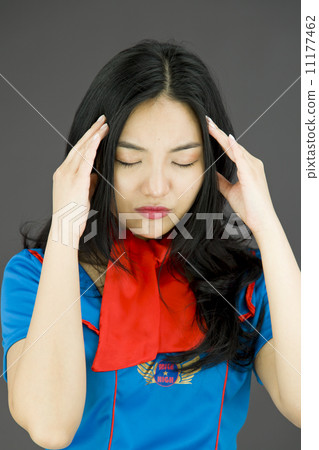 Asian air stewardess suffering from headache 11177462