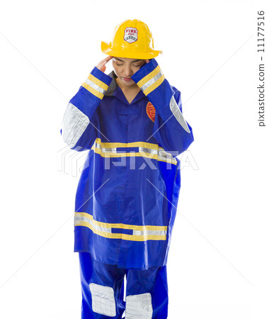 Lady firefighter suffering from headache Lady firefighter suffering from headache 11177516