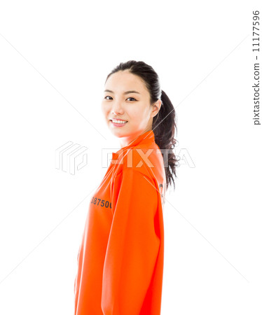 Young Asian woman smiling in prisoners uniform 11177596