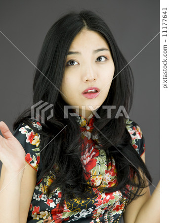 Asian young woman don't know what to do isolated on colored background Asian young woman don't know what to do isolated on colored background 11177641