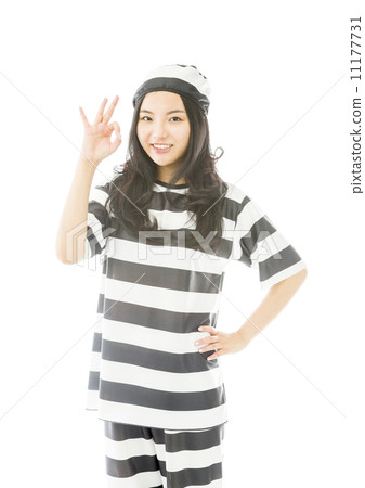 Young Asian woman showing OK sign in prisoners uniform 11177731