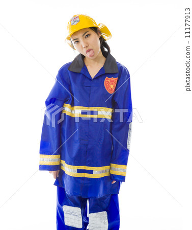 Lady firefighter poking out tongue towards camera isolated on white background Lady firefighter poking out tongue towards camera isolated on white background 11177913