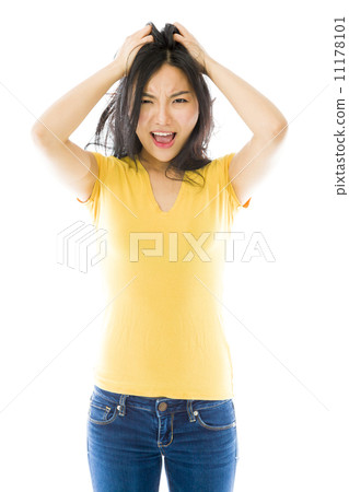 Young Asian woman pulling her hair and screaming in frustration 11178101