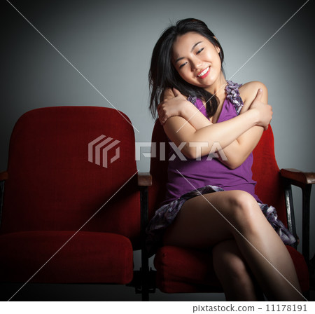 Attractive Asian girl 20s at the theatre isolate white backgroun Attractive Asian girl 20s at the theatre isolate white backgroun 11178191