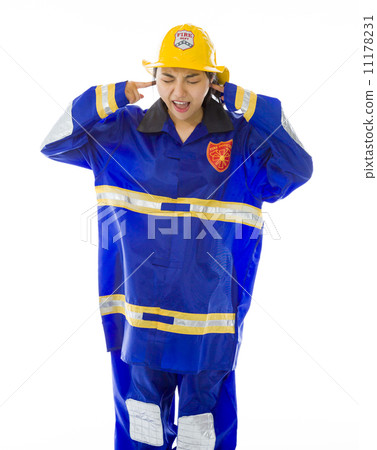 Lady firefighter shouting with hands in ear Lady firefighter shouting with hands in ear 11178231