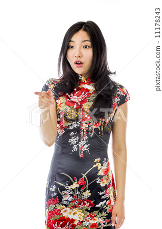 Shocked Asian young woman with pointing isolated on white background Shocked Asian young woman with pointing isolated on white background 11178243