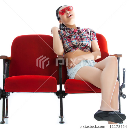 Attractive Asian girl 20s at the theatre isolate white backgroun 11178534