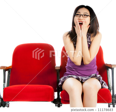 Attractive Asian girl 20s at the theatre isolate white backgroun 11178683