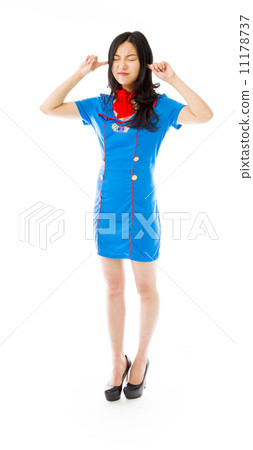 Asian air stewardess looking frustrated with hands in ear 11178737