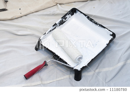 Close-up of a paint roller in a tray Close-up of a paint roller in a tray 11180780