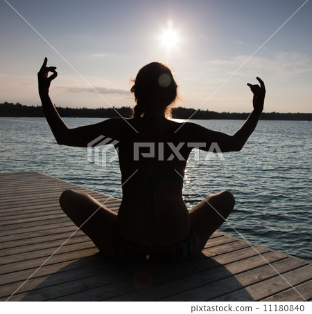 Silhouette of a woman practicing yoga at a pier, Georgian Bay, T Silhouette of a woman practicing yoga at a pier, Georgian Bay, T 11180840