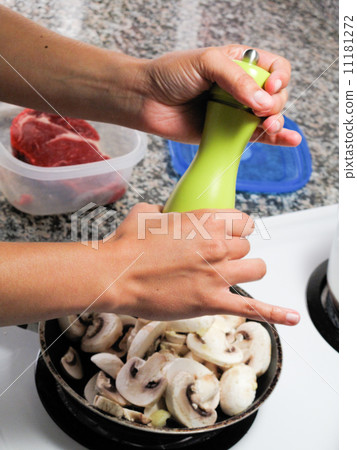 Close-up of human's hand cooking food 11181272