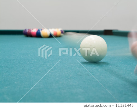 Cue ball in motion reaching toward pool balls 11181443