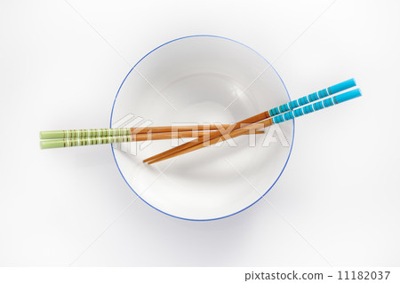 chopsticks in empty bowl isolated on a white background chopsticks in empty bowl isolated on a white background 11182037