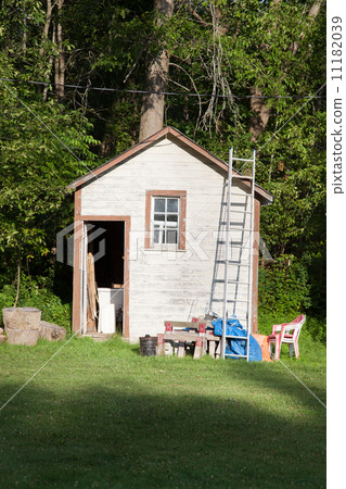Open door of a log cabin, Tobermory, Ontario, Canada 11182039