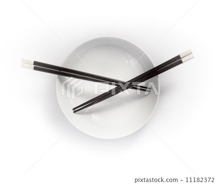 chopsticks in empty bowl isolated on a white background 11182372