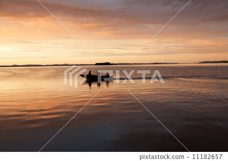 Boat in a bay at sunset, Georgian Bay, Tobermory, Ontario, Canad 11182657