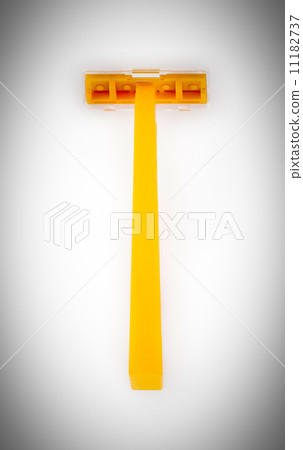 orange disposable razor isolated on a white background 11182737