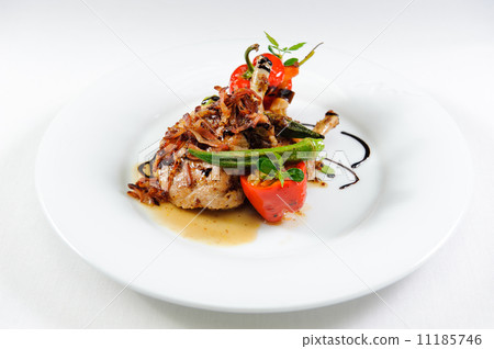 Grilled pork chop flamed in gin with sweet and sour vegetable ra Grilled pork chop flamed in gin with sweet and sour vegetable ra 11185746