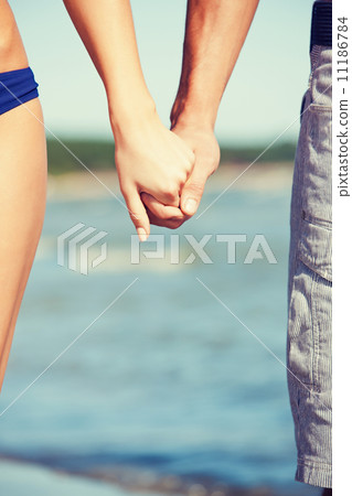 man and woman holding hands man and woman holding hands 11186784
