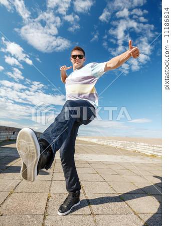 handsome boy making dance move 11186814