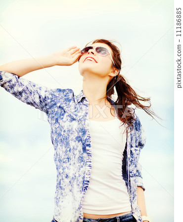 teenage girl in shades outside 11186885