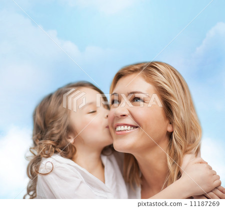 smiling mother and daughter hugging 11187269