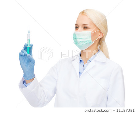 doctor in mask holding syringe with injection doctor in mask holding syringe with injection 11187381
