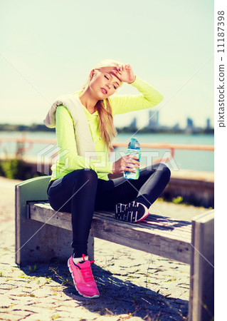 woman resting after doing sports outdoors 11187398