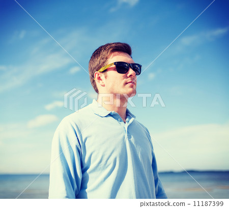man in sunglasses on the beach man in sunglasses on the beach 11187399