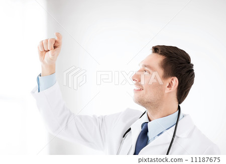 young doctor holding something imaginary 11187675