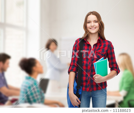 smiling female student with bag and notebooks 11188023