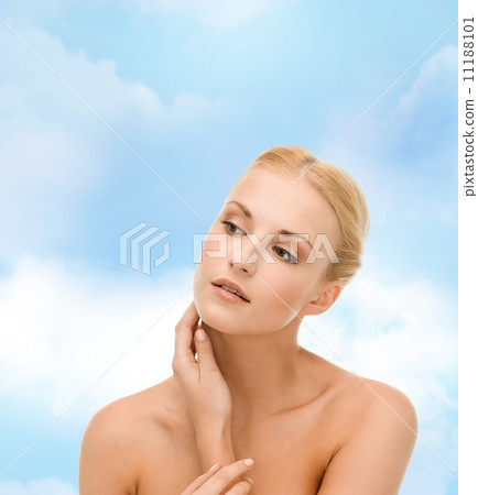 beautiful woman touching her face skin 11188101