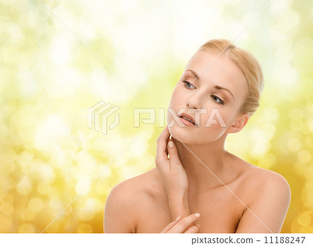 beautiful woman touching her face skin 11188247