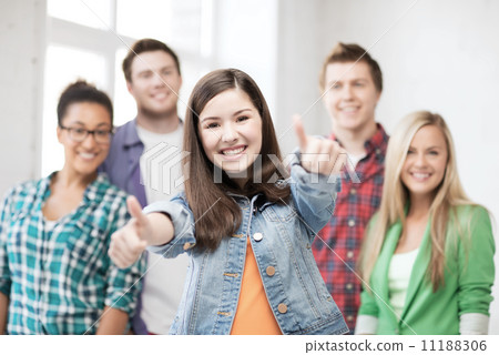 students showing thumbs up at school 11188306