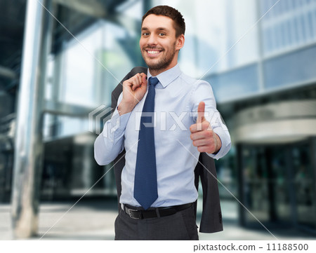 handsome buisnessman with jacket over shoulder 11188500