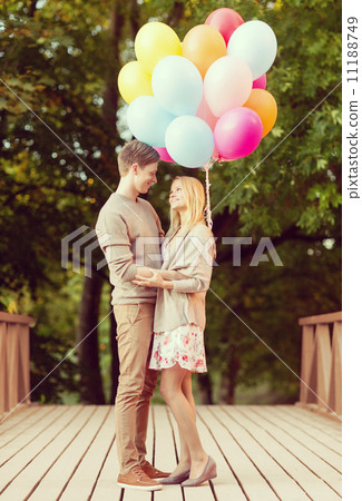 couple with colorful balloons couple with colorful balloons 11188749