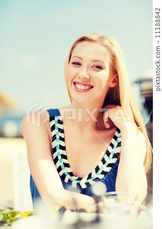girl in cafe on the beach girl in cafe on the beach 11188842
