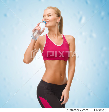 smiling woman with bottle of water 11188843
