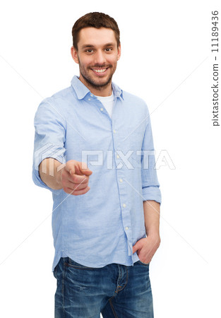 smiling man pointing finger at you 11189436