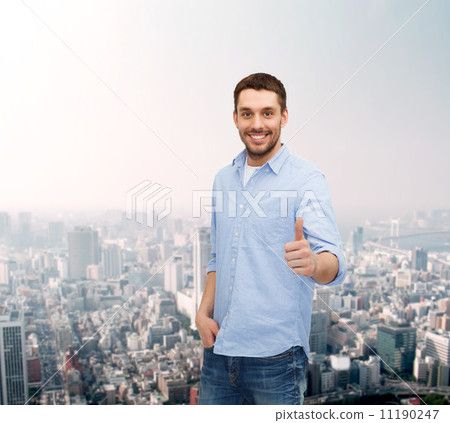 smiling man showing thumbs up smiling man showing thumbs up 11190247