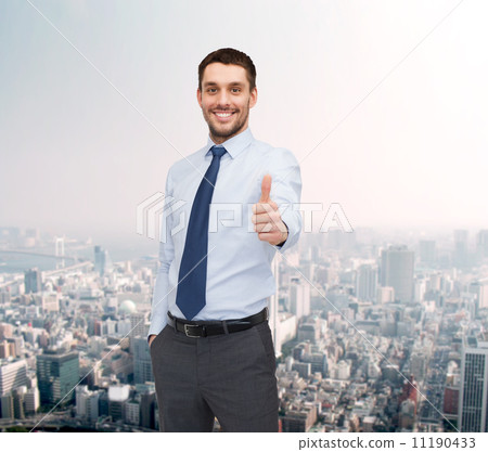 handsome businessman showing thumbs up handsome businessman showing thumbs up 11190433