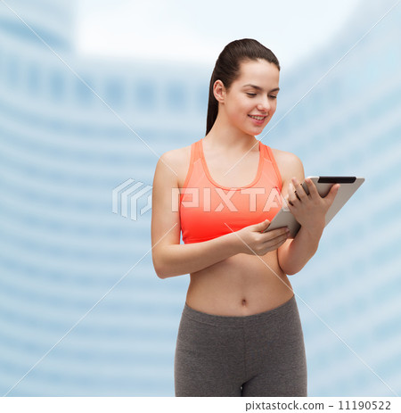 sporty woman with tablet pc computer sporty woman with tablet pc computer 11190522