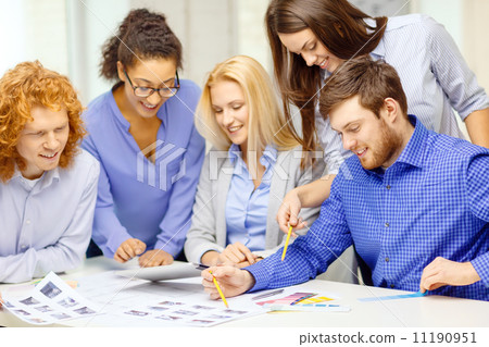 smiling team with color samples at office smiling team with color samples at office 11190951