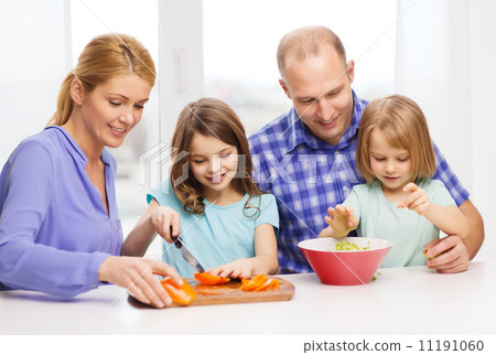 happy family with two kids making dinner at home happy family with two kids making dinner at home 11191060